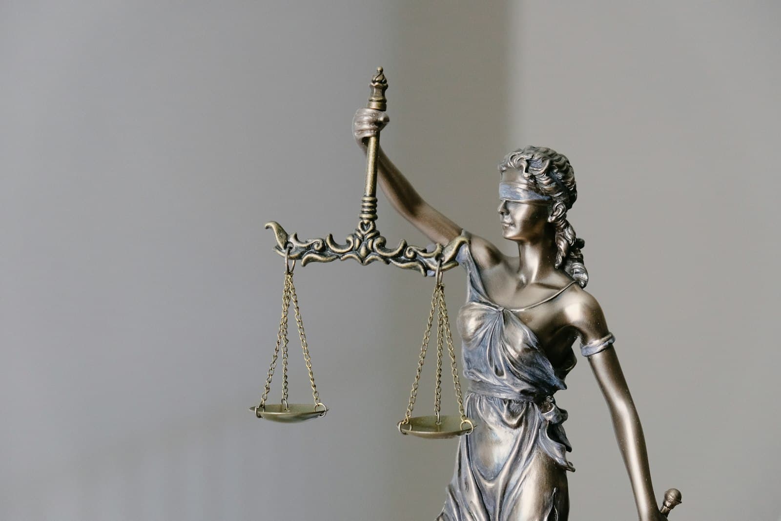 Attorney in business attire at a modern law office desk